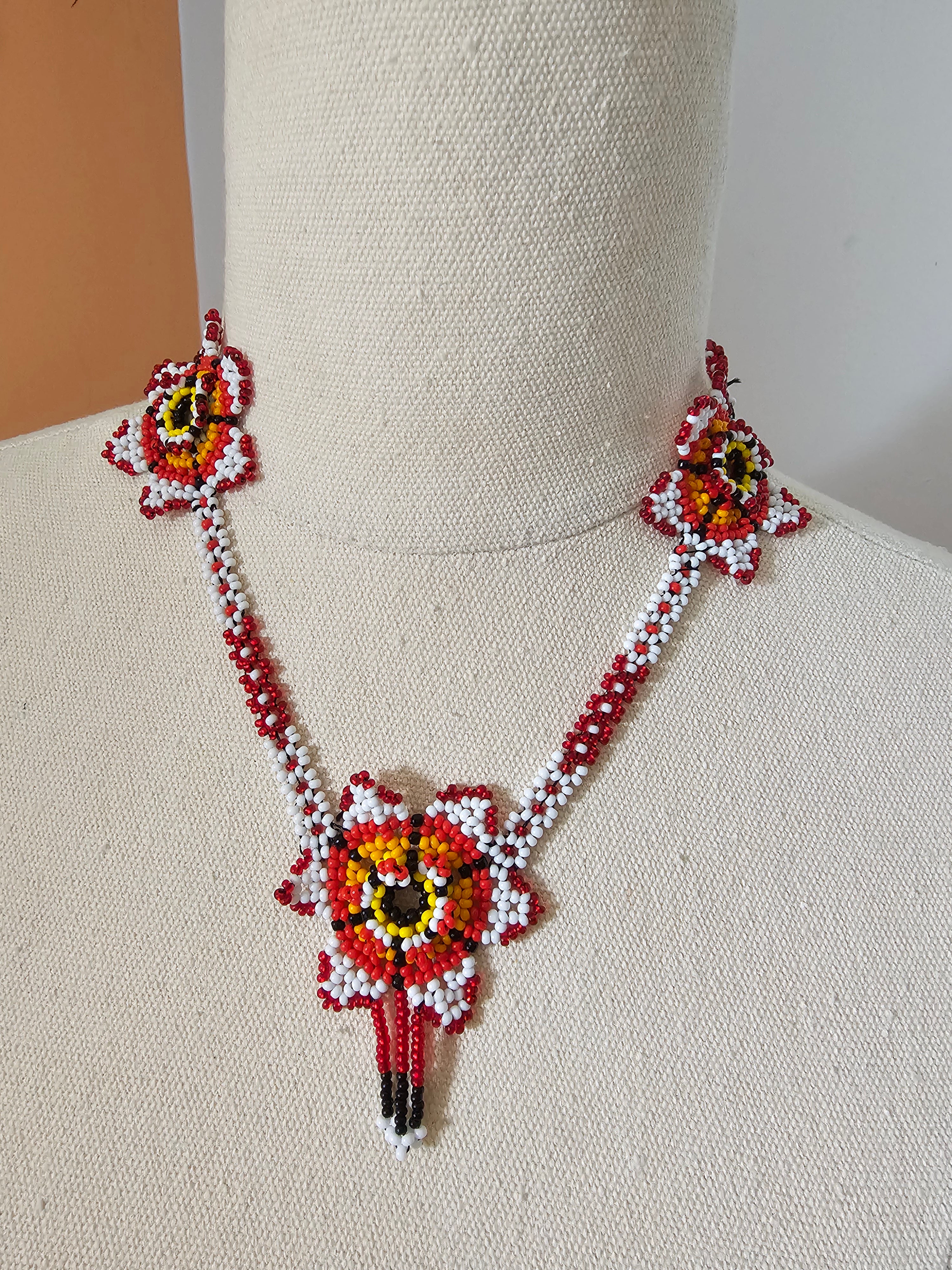 Decorative headband with floral designs on a beige background