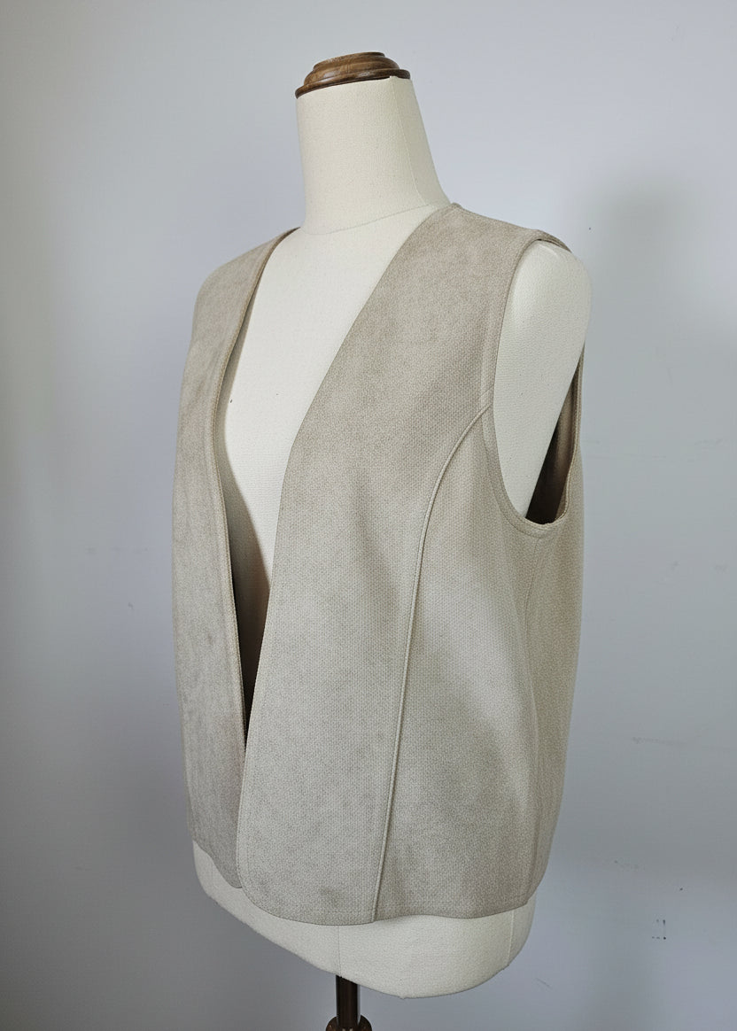 Mannequin wearing a beige trench coat against a plain background