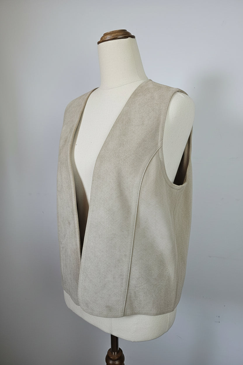 Mannequin wearing a beige trench coat against a plain background