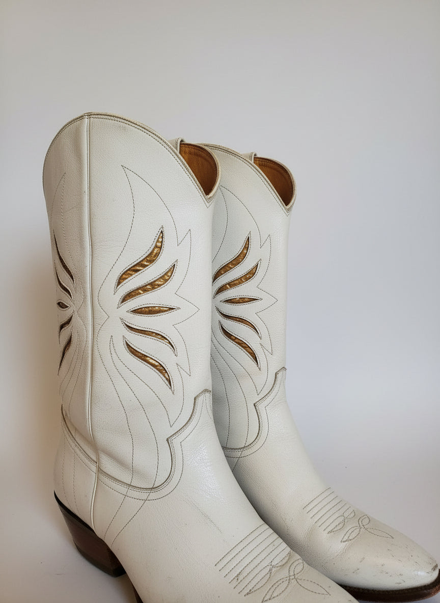 Close-up of white leather with brown floral patterns on a white background