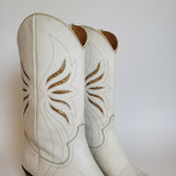 Close-up of white leather with brown floral patterns on a white background