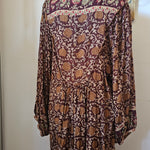Back view of Tree of Life boho block print dress – plum floral print with flowy hemline

