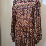 Back view of Tree of Life boho block print dress – plum floral print with flowy hemline


