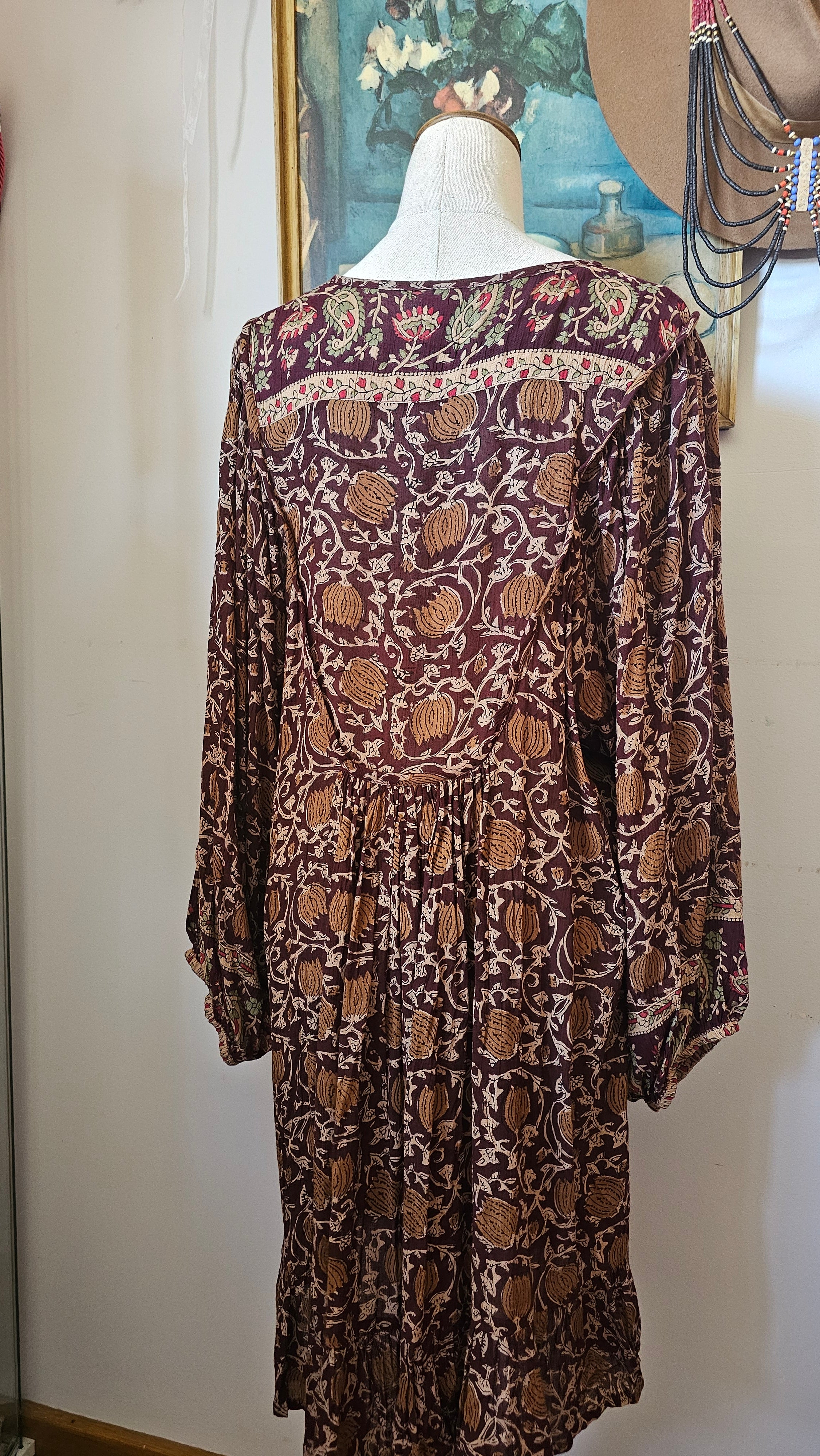 Back view of Tree of Life boho block print dress – plum floral print with flowy hemline

