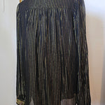 Traditional black garment with decorative elements on a white background