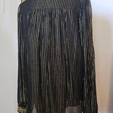 Traditional black garment with decorative elements on a white background